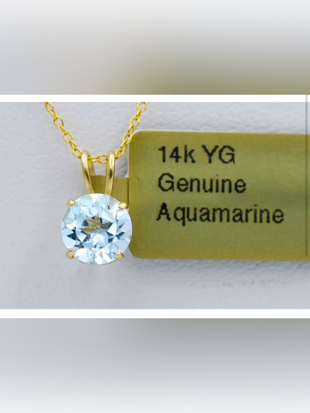 14k solid yellow gold round aqua marine pendant.